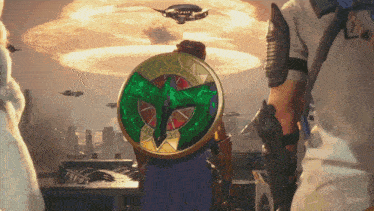 a man holding a shield with a cross on it stands in front of a huge explosion