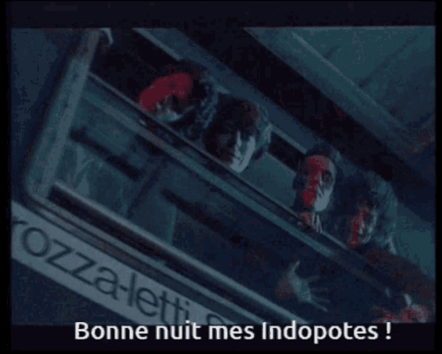 a group of people looking out of a window with the words bonne nuit mes indopotes
