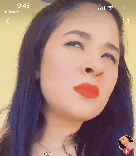 a woman 's face is displayed on a phone screen with the time of 9:43