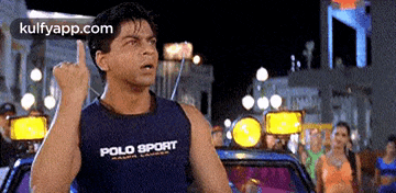 a man wearing a polo sport tank top is giving a middle finger
