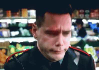 a man with a red spot on his forehead looks at something