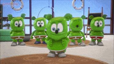 a group of gummy bears are standing in a room with the word gummy bears on the bottom