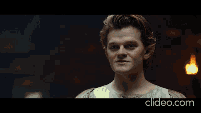 a man 's face is shown in a clip with the word understood below it