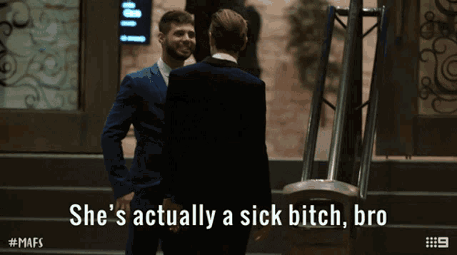a man in a suit says she 's actually a sick bitch bro while standing next to another man