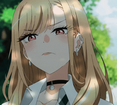 a close up of a girl with long blonde hair