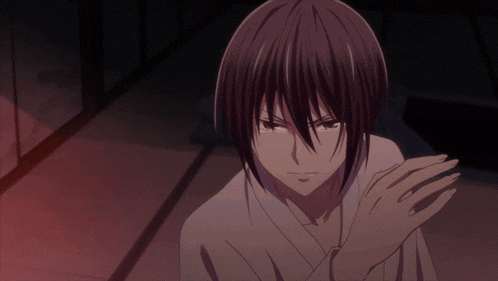 a cartoon character with dark hair and a white shirt looks angry