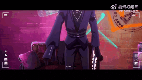 a man in a black suit is standing in front of a brick wall and a camera with the time of 00 00 17 22
