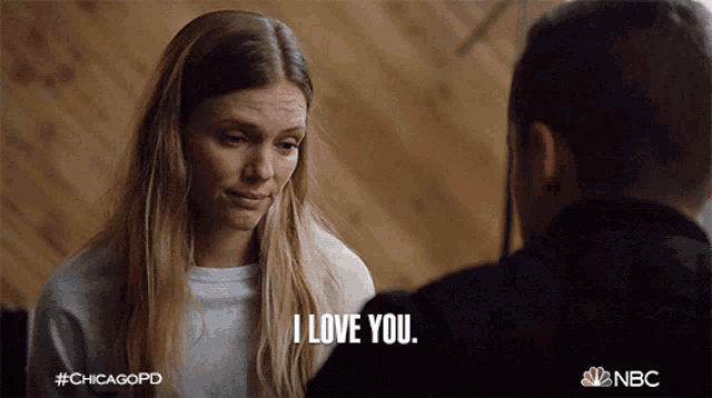 a woman says " i love you " to a man