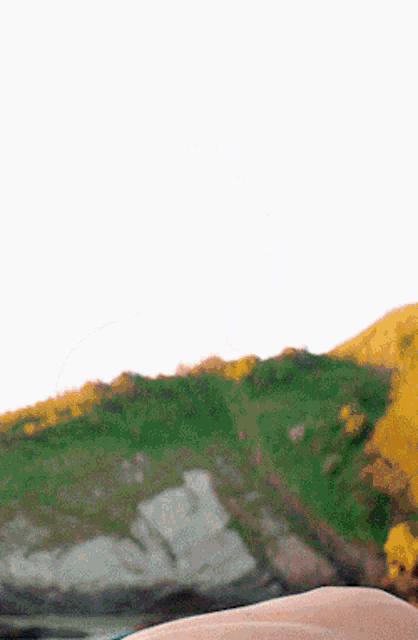 a person laying on the ground with a blurred background