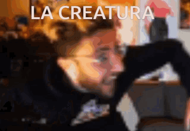 a blurry picture of a person with the words la creature written above them