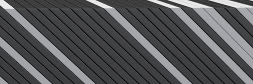 a close up of a black and white striped wall .