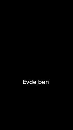 a man with a beard and earrings is wearing a black t-shirt that says disarida ben on it .