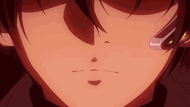 a close up of a person 's face with a shadow behind them
