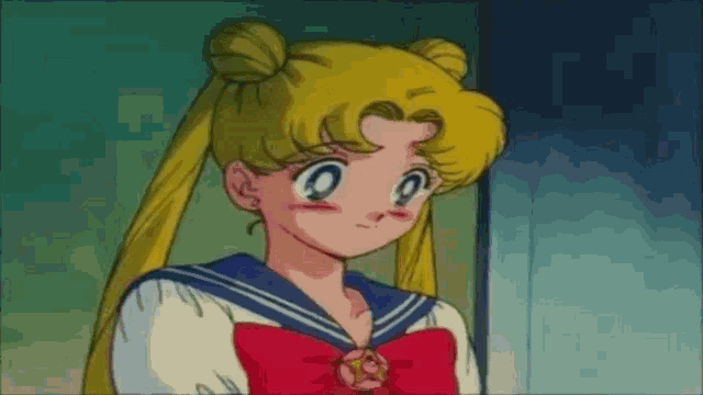sailor moon from the anime sailor moon is wearing a sailor uniform with a red bow and a star on her chest .