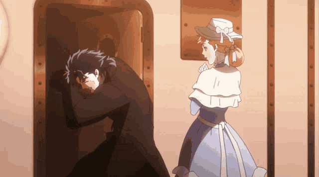 a man in a black suit and a woman in a blue dress are standing next to each other