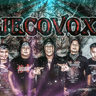 a group of men standing in front of a sign that says ' jrcovox '