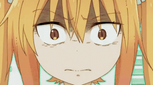 a close up of a cartoon character 's face with a very angry look on her face .