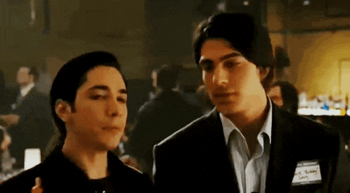 two men are standing next to each other and one of them has a name tag that says " mr. bobby levy " on it