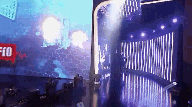 a person is standing on a stage in front of a screen that says ' f10 ' on it .