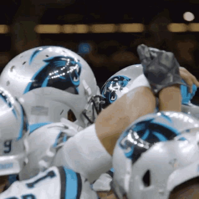 a football player wearing a helmet with a panther logo