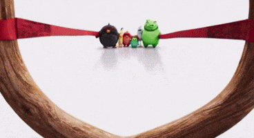 a group of angry birds sitting on a wooden ring