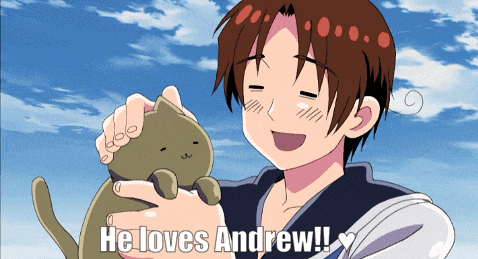 a boy holding a cat with the words he loves andrew