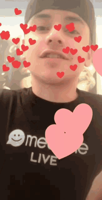 a man wearing a shirt that says omegle live is surrounded by hearts