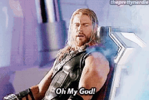 thor is sitting in a chair saying oh my god .