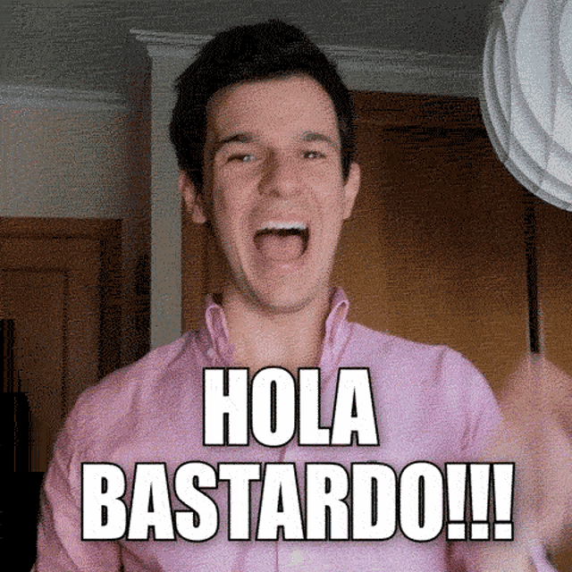 a man in a pink shirt says hola bastardo with his mouth open