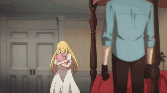 a girl in a white dress is hugging a pink stuffed animal