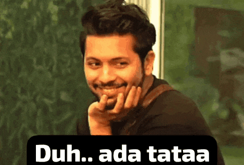 a man with a beard is smiling with his hand on his chin and a caption that says duh ada tataa