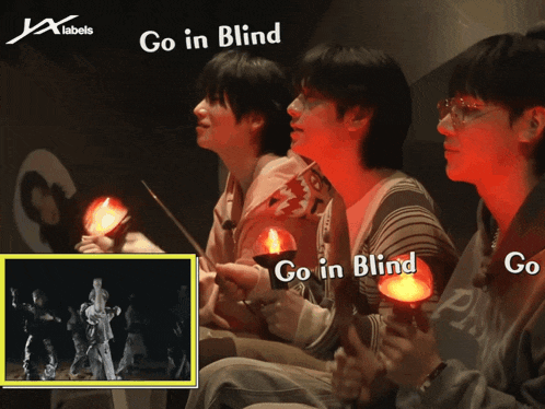 a group of people holding candles with the words go in blind on the bottom