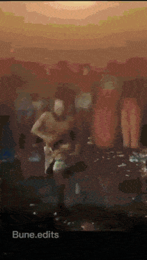 a blurred image of a man dancing with the words bune.edits at the bottom