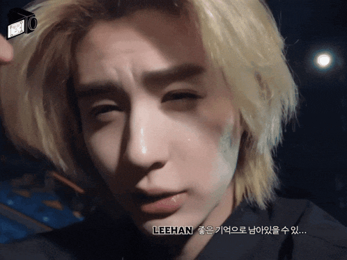 a close up of a person 's face with the name leehan written on the bottom