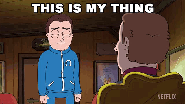 a man in a blue jacket is talking to another man with the words this is my thing written above him
