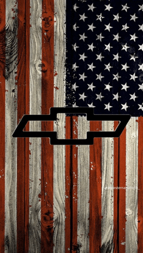 a chevrolet logo is on a wooden american flag background