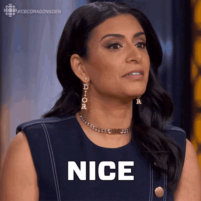 a woman wearing a choker and earrings says " nice "