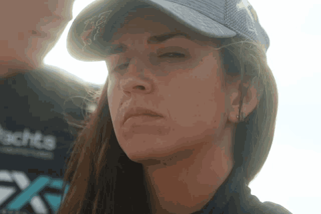 a woman wearing a hat with the word echts on it