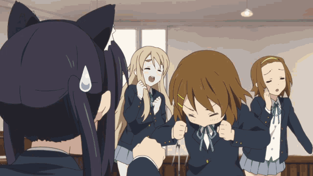 a group of anime girls are standing in a room and one of them has a cat ear