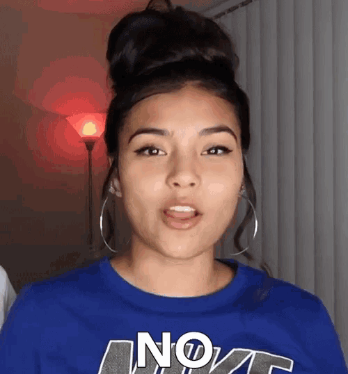 a woman wearing a blue shirt that says no