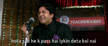 a man is giving a speech in front of a sign for teacher 's day