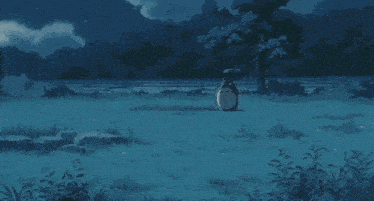a totoro sits in a field with an umbrella