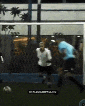 a soccer game is being played with the name taldosaopaulino on the bottom right