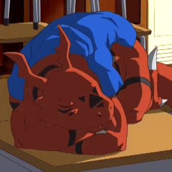 a cartoon character is laying down on a desk