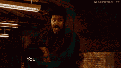 a man with a mustache is making a face and saying you done fucked up now