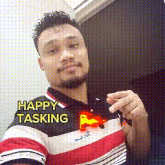 a man in a striped shirt is holding a key with the words happy tasking written on it