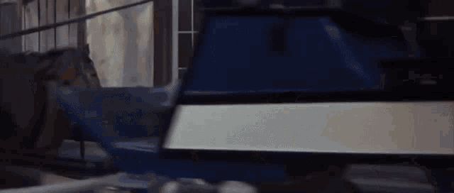 a blue and white object is sitting on top of a table .