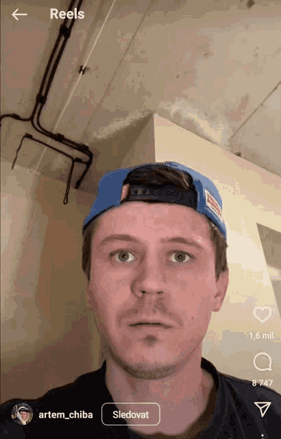 a man wearing a blue hat is shown in a reels app