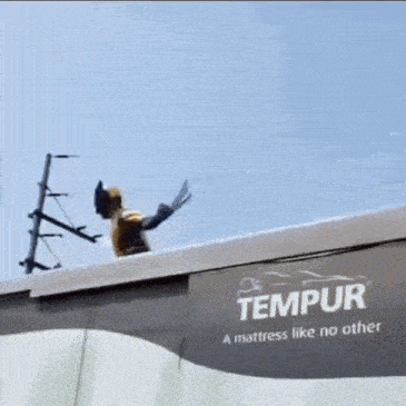a tempur mattress is advertised on the side of this truck