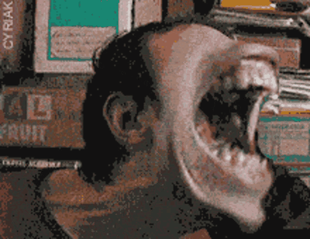 a close up of a person 's face with a box of fruit behind them